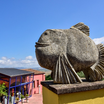 Exterior of the museum with a focus on a stone artwork (photoIvo Piras)