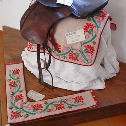 Exhibition of a saddle and decorations inside the museum