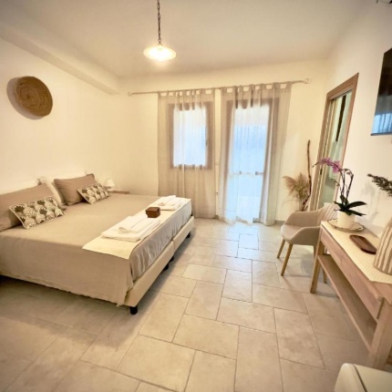 Camere da letto (foto Booking, Domus La Roccia)